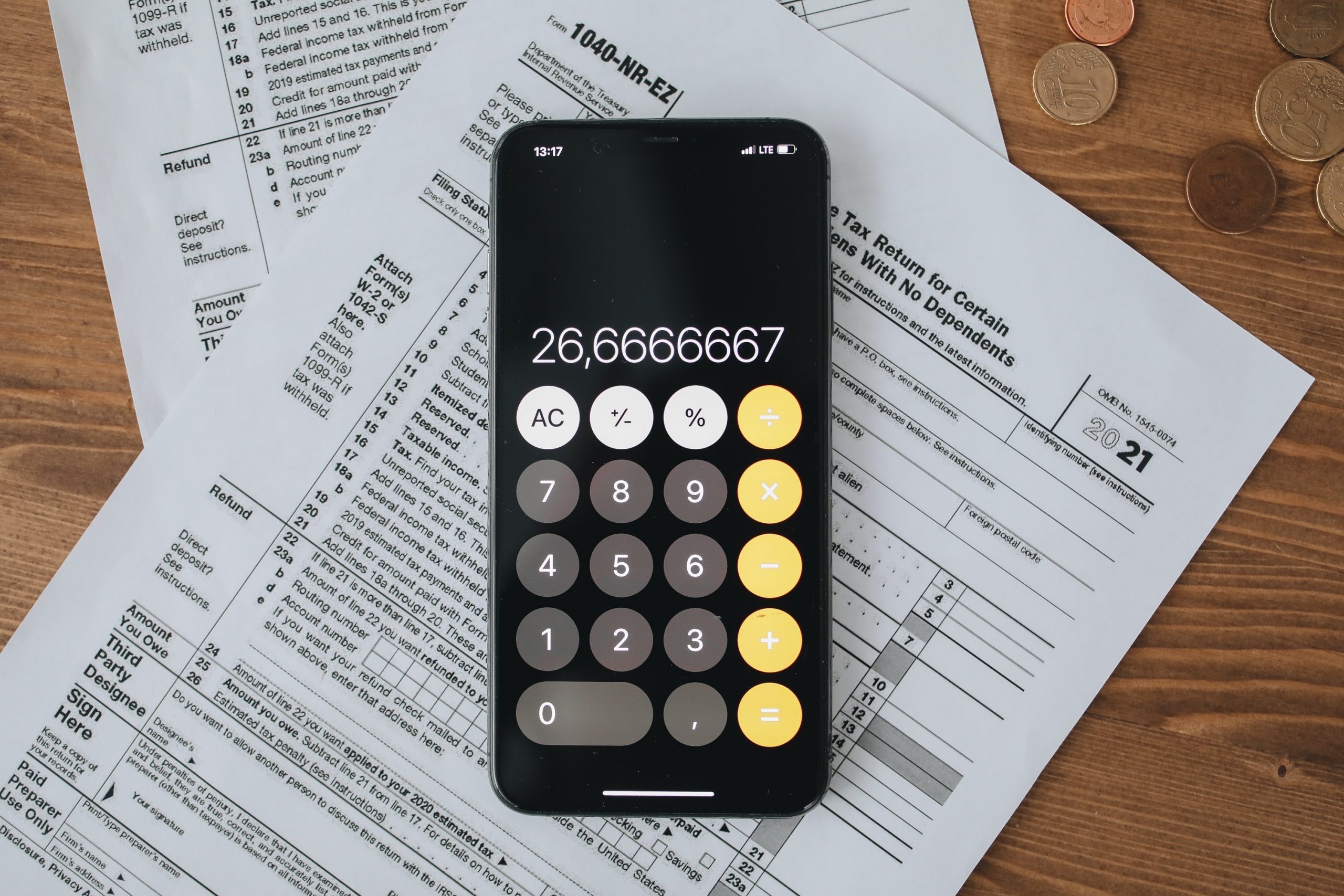 Photo by Polina Tankilevitch: https://www.pexels.com/photo/tax-forms-with-calculator-on-wooden-surface-6927334/